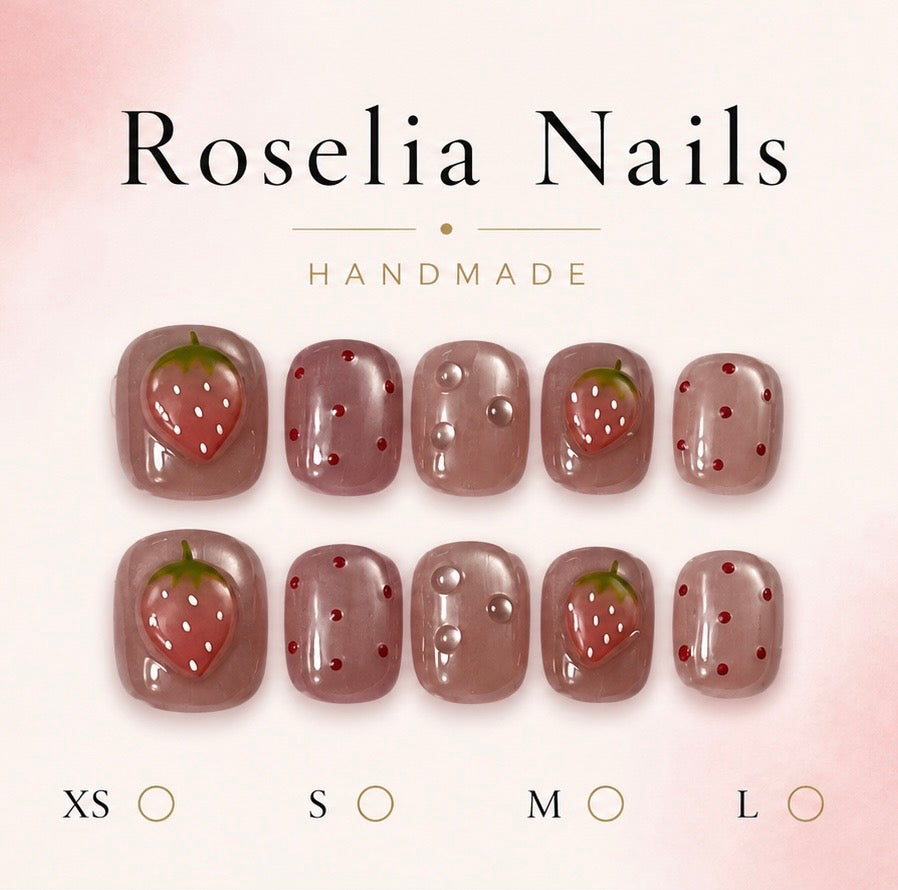 Mauve jelly nails scattered with fine red dots