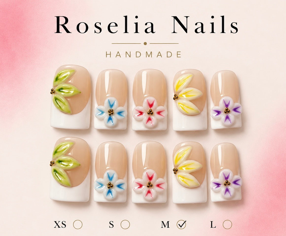 White French nails with five sculpted flowers in different colours