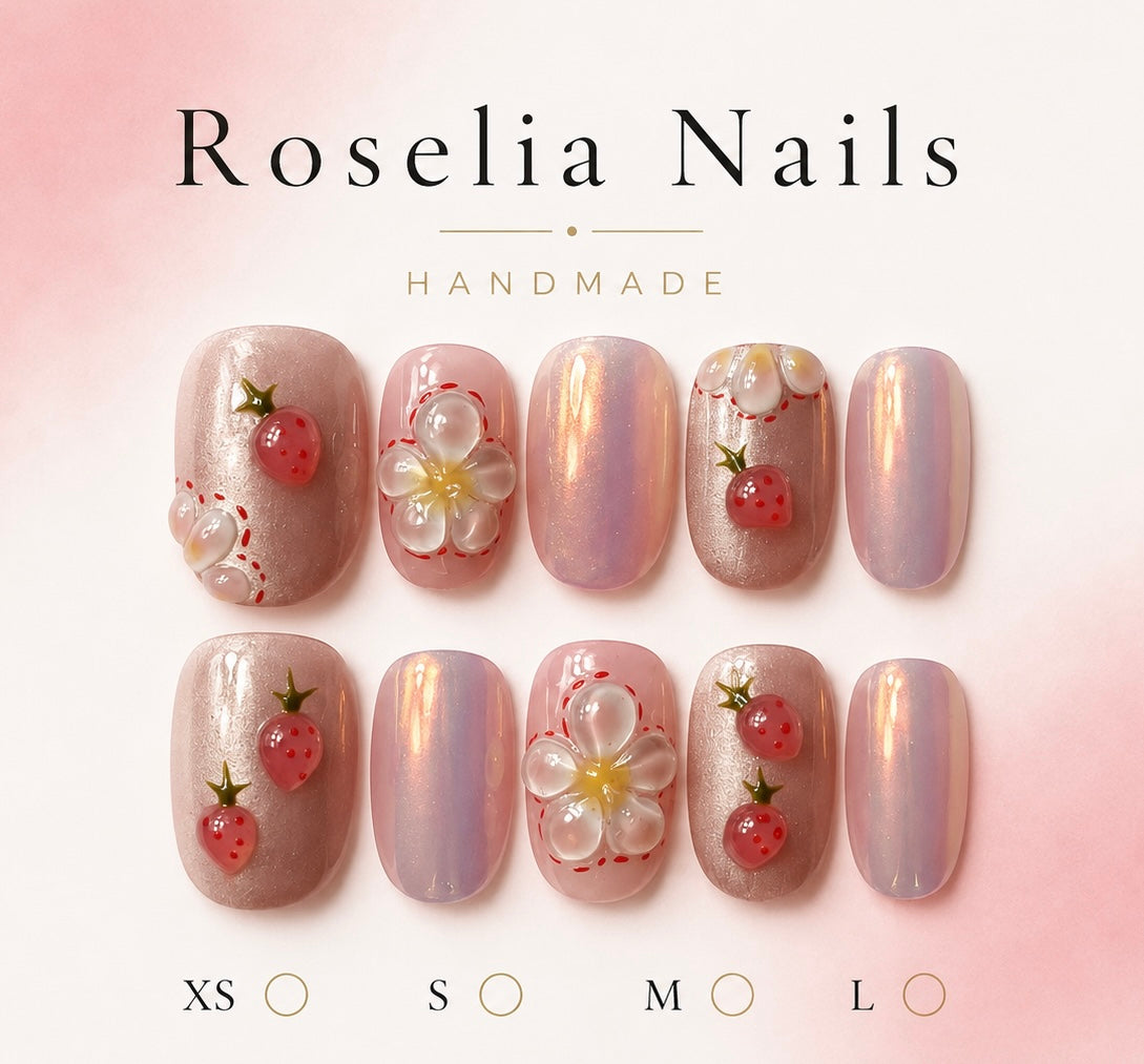 Pearl chrome nails with sculpted strawberries and a white blossom
