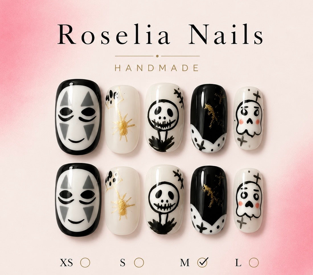 Roselia Ink Ghosts press on nail set, cream and black nails with hand drawn spooks and a gold spider